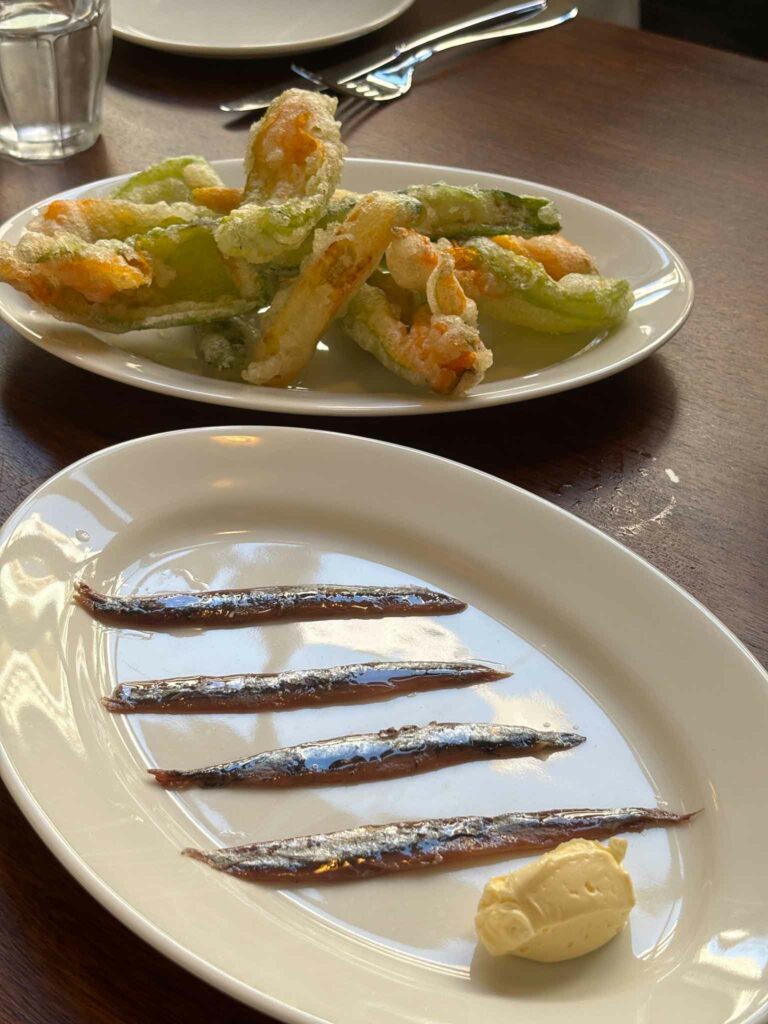 Anchovies with smoked butter and tempura zucchini flowers at Bar Super in Barcelona