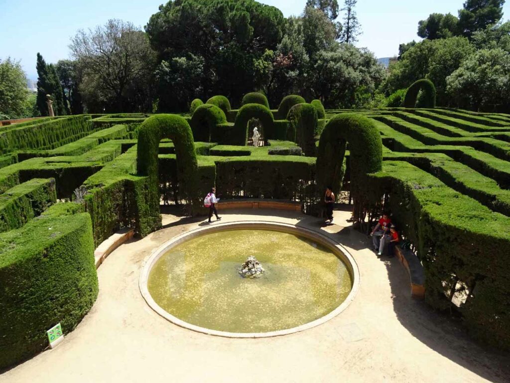 A fountain surrounded by a hedge maze at the Parc del Laberint d'Horta in Barcelona
