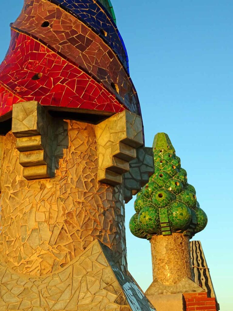 Pretty, colorful mosaics on the chimneys on the roof of Palau Güell in Barcelona. It's a great alternative to avoid tourist crowds.