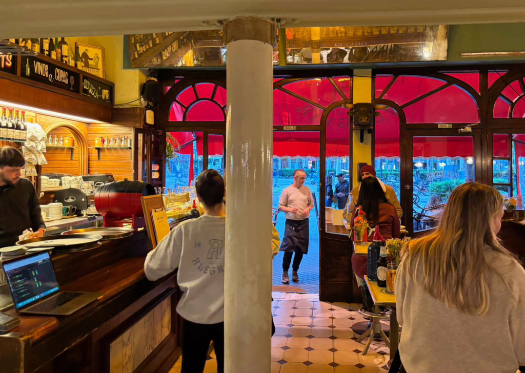 Old-schoolrestaurant interior with a bar at the side and the street in the background